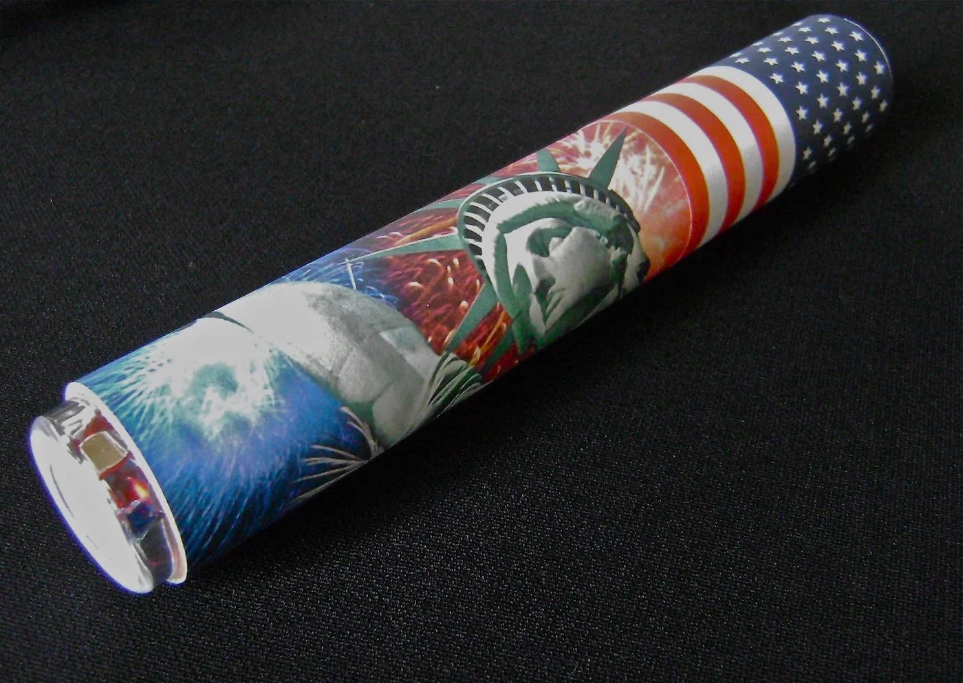 step 11- Print out July 4th images on a sheet of paper or find already decorated paper at craft stores. Roll the paper around the tube and glue it in place.