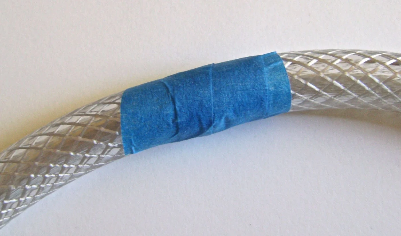 step 2 - Wrap tape around the hose ends to hold them together and form a complete circle.