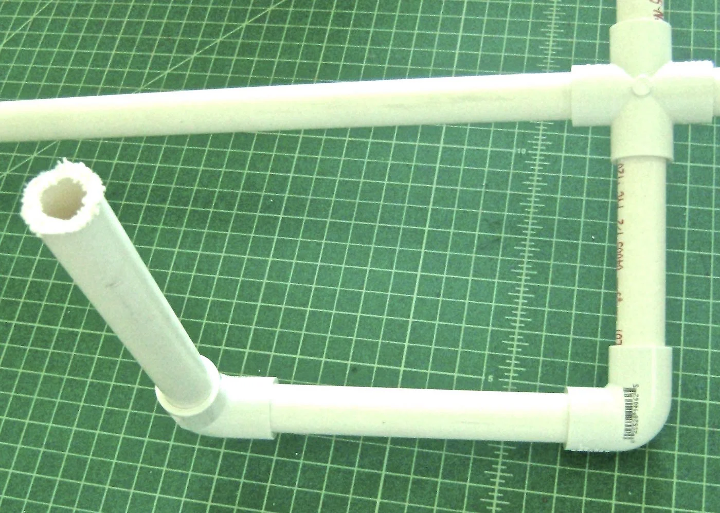 step 7 - Use elbow connectors to attach the arms. They will allow you to position the upper and lower arms.