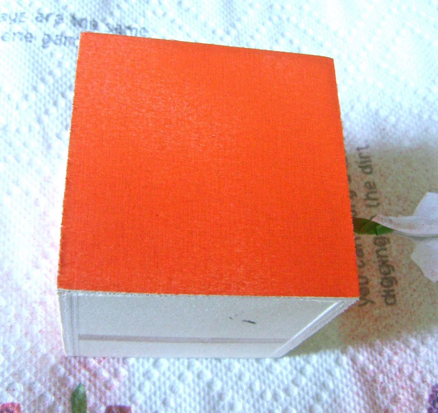 step 3 - On a protected surface, airbrush each cube with one color on four sides. Allow the paint to dry and apply a second coat.