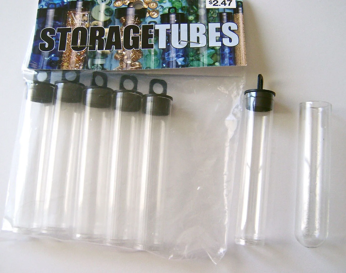 Plastic Craft Tubes are used for storing beads and other small objects. Glass vials can also be used.