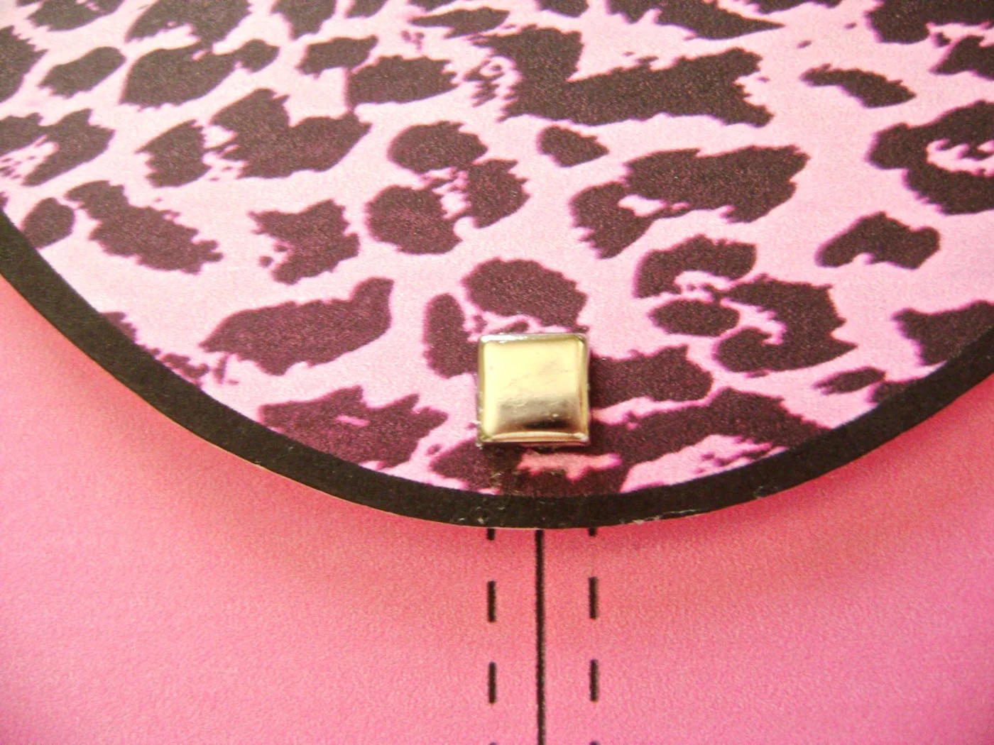 step 9 - Flatten the prongs on the square stud. Apply E6000 glue to the back and attach it to the bottom center of the flap.