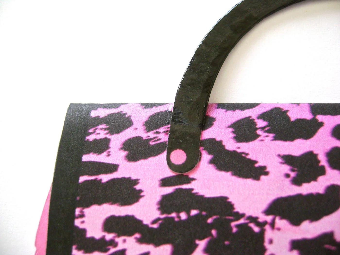 step 10 - Apply glue to the handle ends and attach them to the top of the front flap.