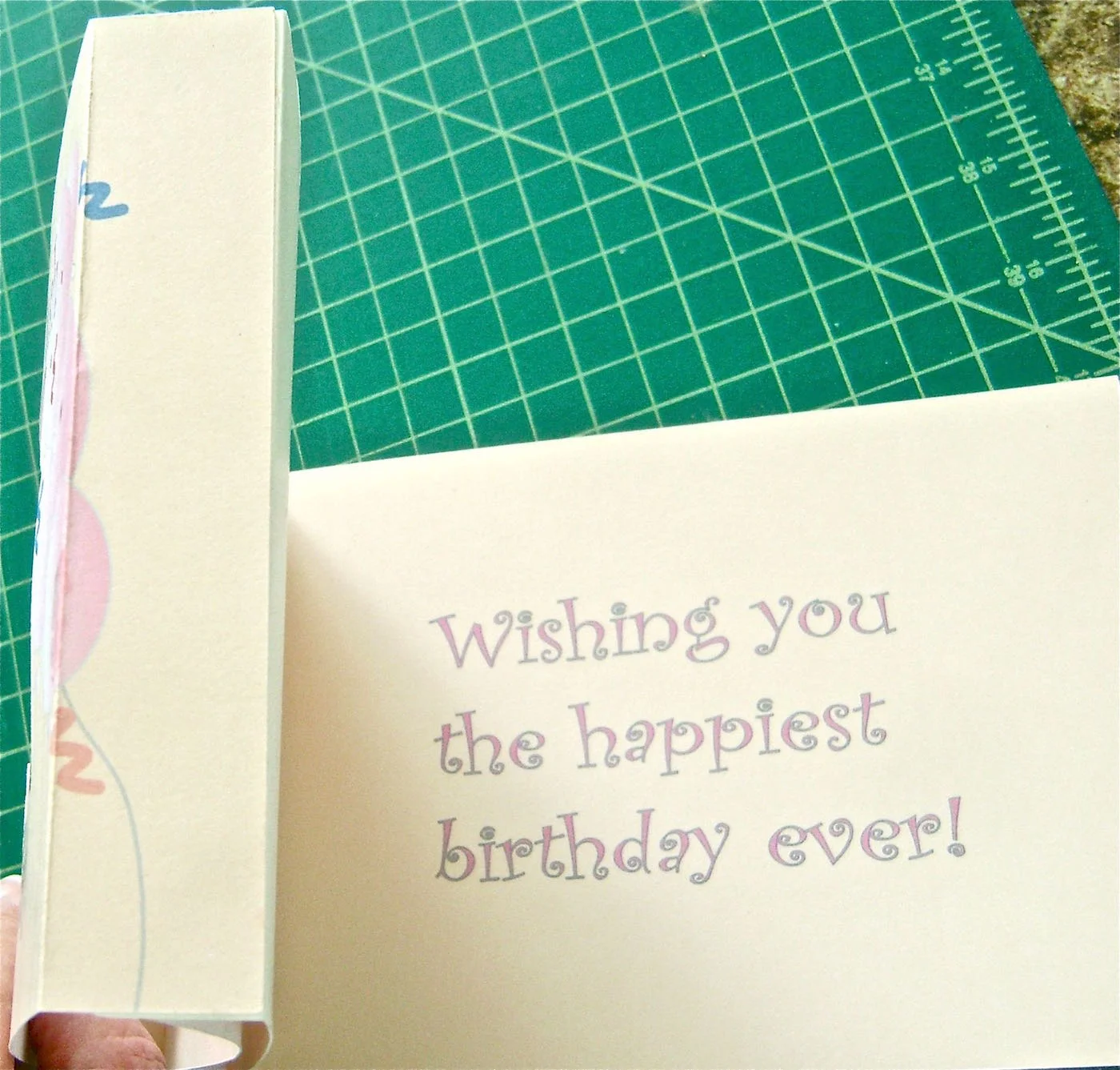 step 9 - To finish the card, rub the glue stick on the blank side of the flaps of page 1. Press the glued flaps against the blank flap of page 4 on the left side and page 3 on the right side. The printed edges of page one should be up against the fold of pages 3 and 4. Be sure the bottoms are aligned.