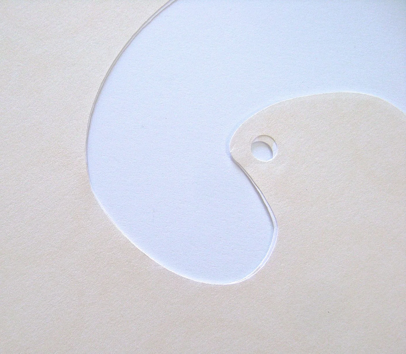 step 4 - Use a paper punch to create a hole through both layers at once.