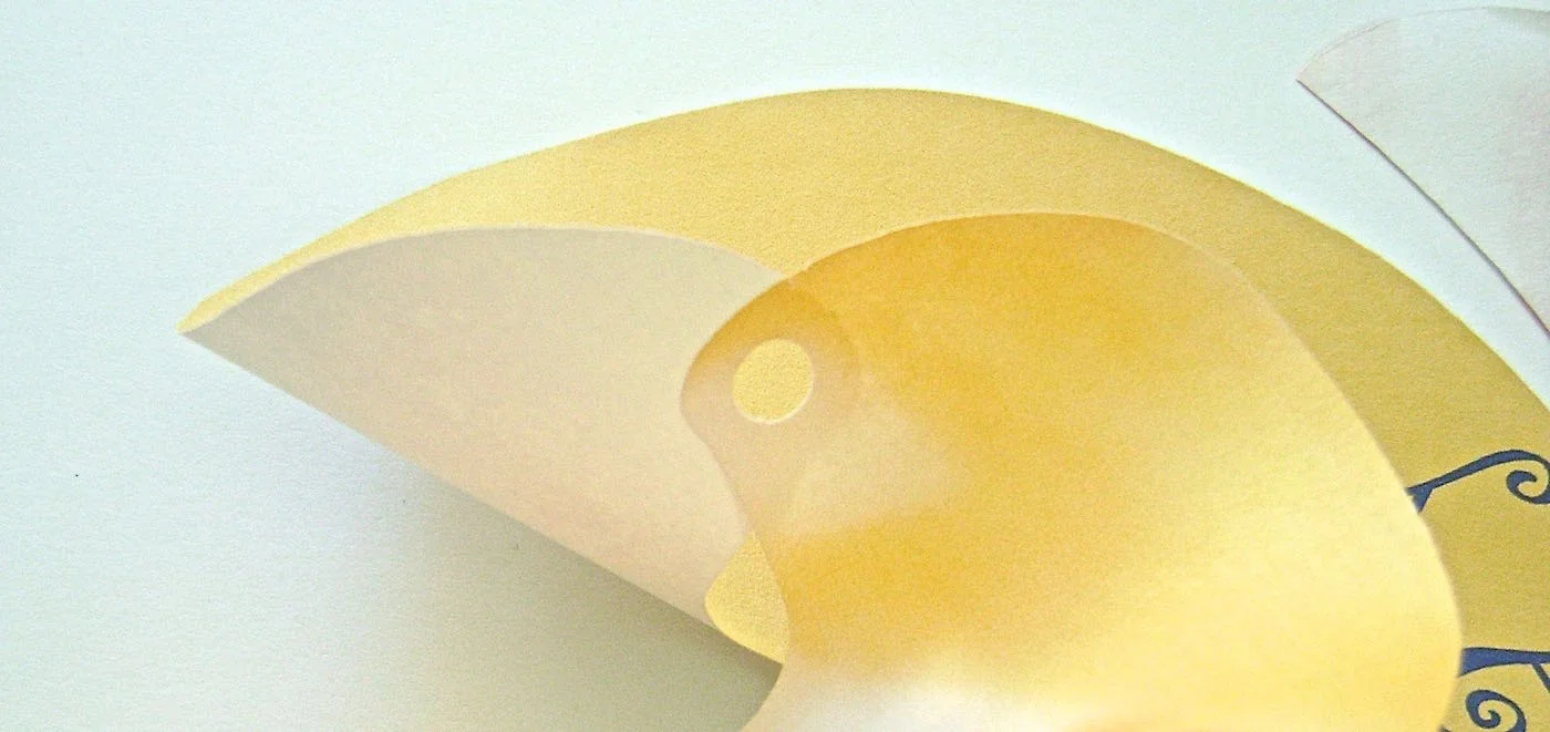 step 4 - Overlap and glue the hole in the text layer onto the non-printed side of the image layer.