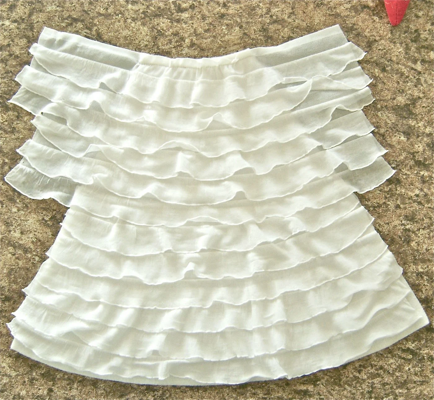 step 6 - The next strip to attach is the 12”. The last will be the 15”. These two strips do not have tails. The end of the strip should match the edge of the fleece. Trim if necessary.