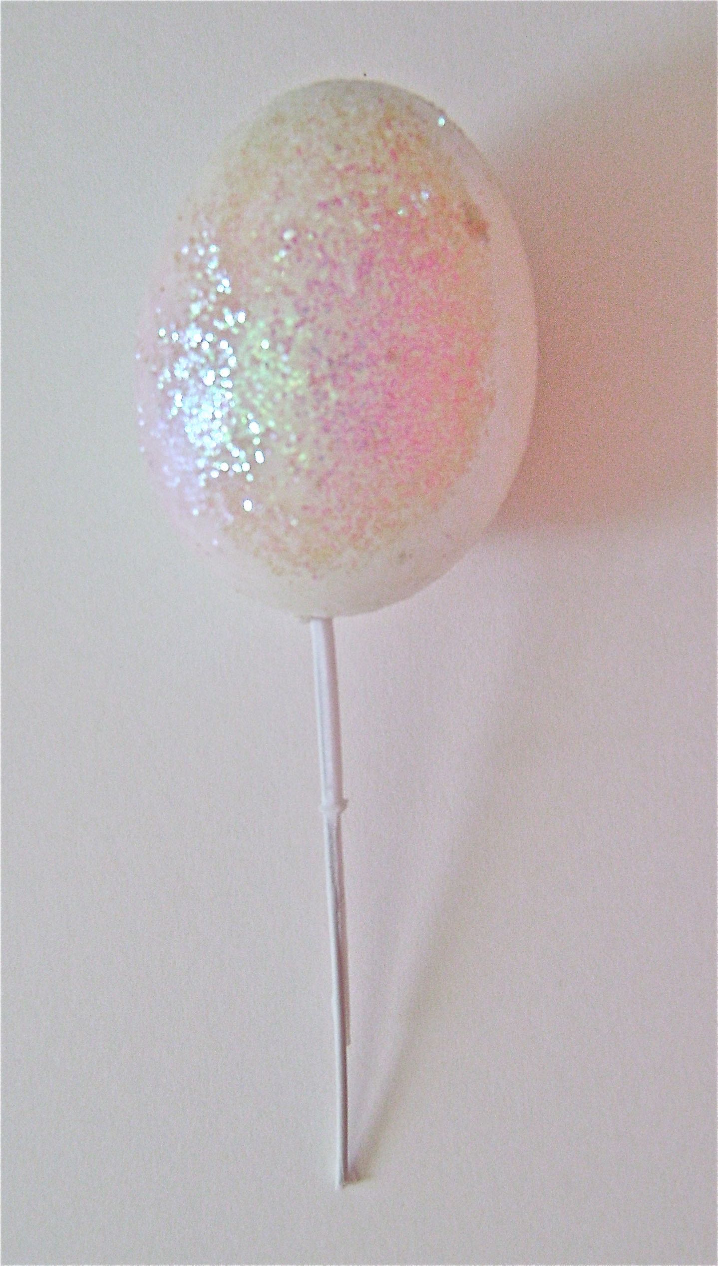 step 9 - Head & Neck I used a remnant from an Easter egg wreath project for the angel head. It had the wire attached to the egg shape. You can create a head with a painted Styrofoam egg and glue wire into it, or use a painted wooden egg. Ball Christmas ornaments are another good option for an angel head.