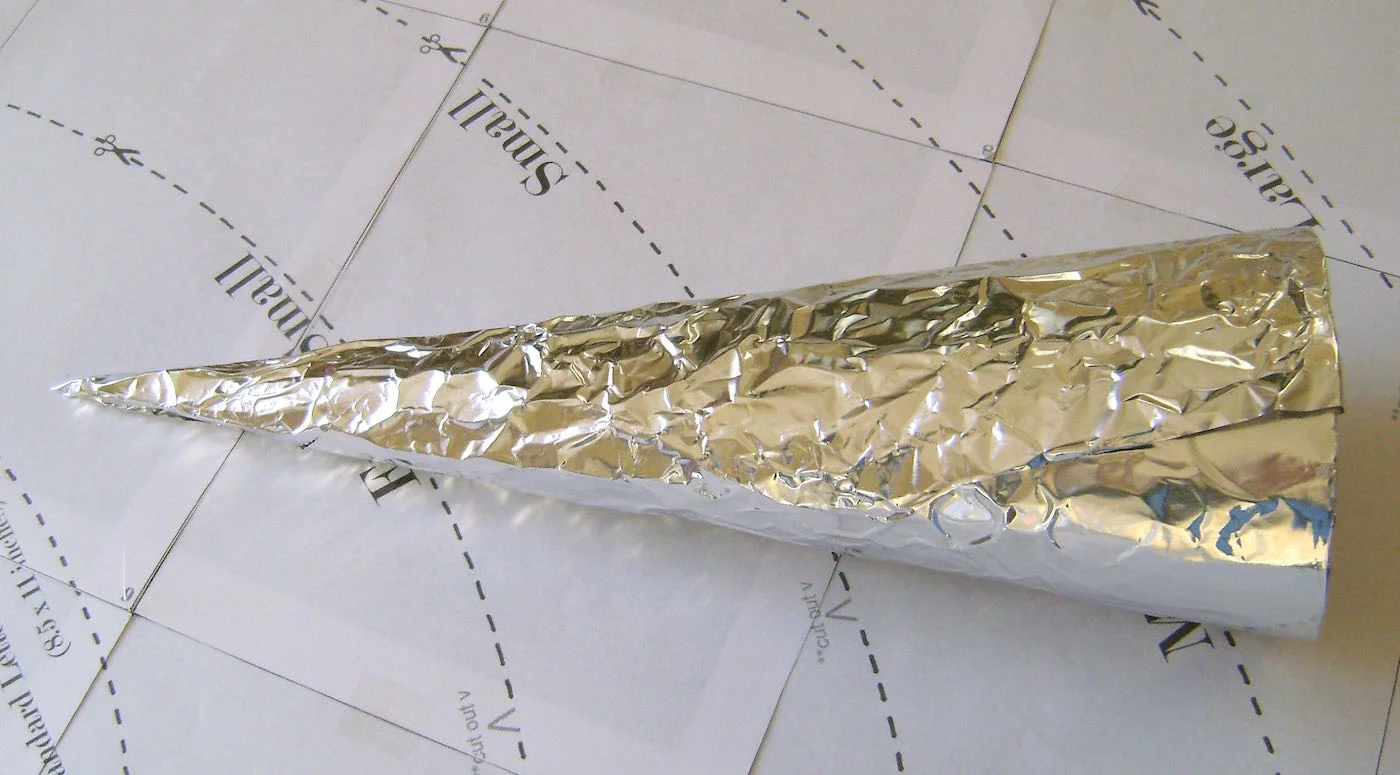 step 5 - Cover the card stock cone with heavy duty aluminum foil, make it as smooth as possible.