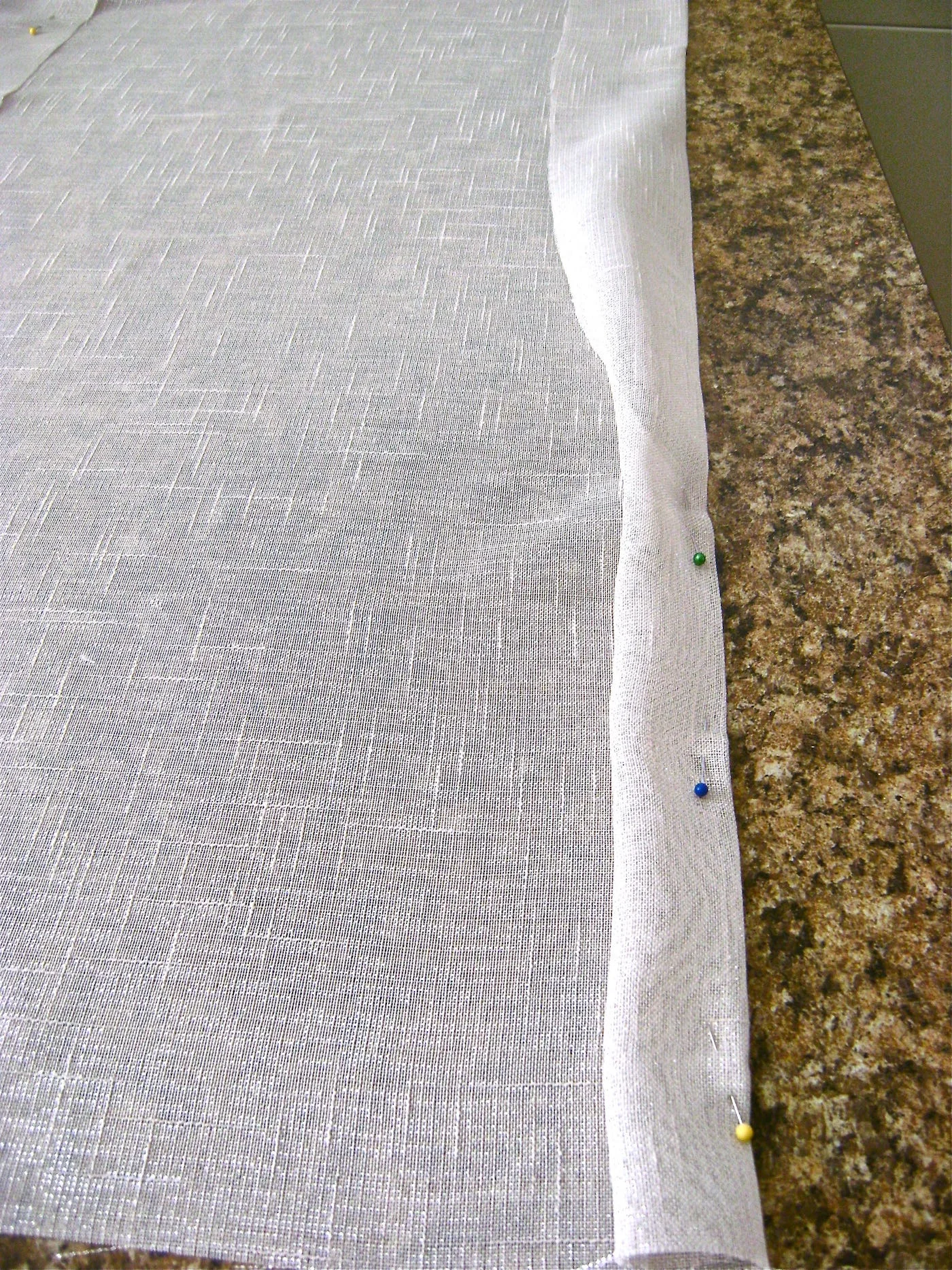 step 3 - Fold the raw edges into the pressed crease on each side then press in place.