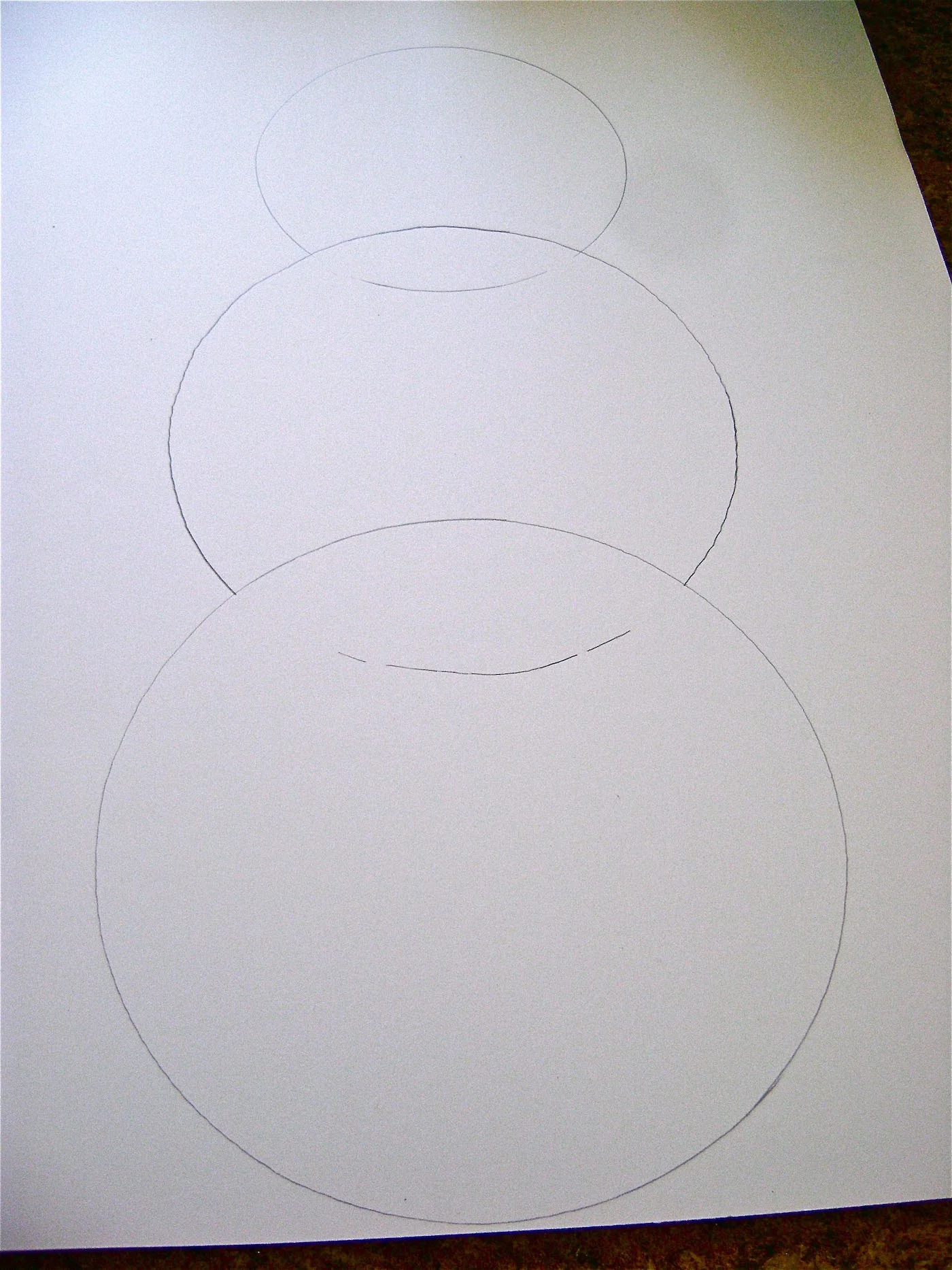 step 1 - The Snowman Lightly draw three different size circles on the foam board with a pencil, with each circle overlapping the one below it.