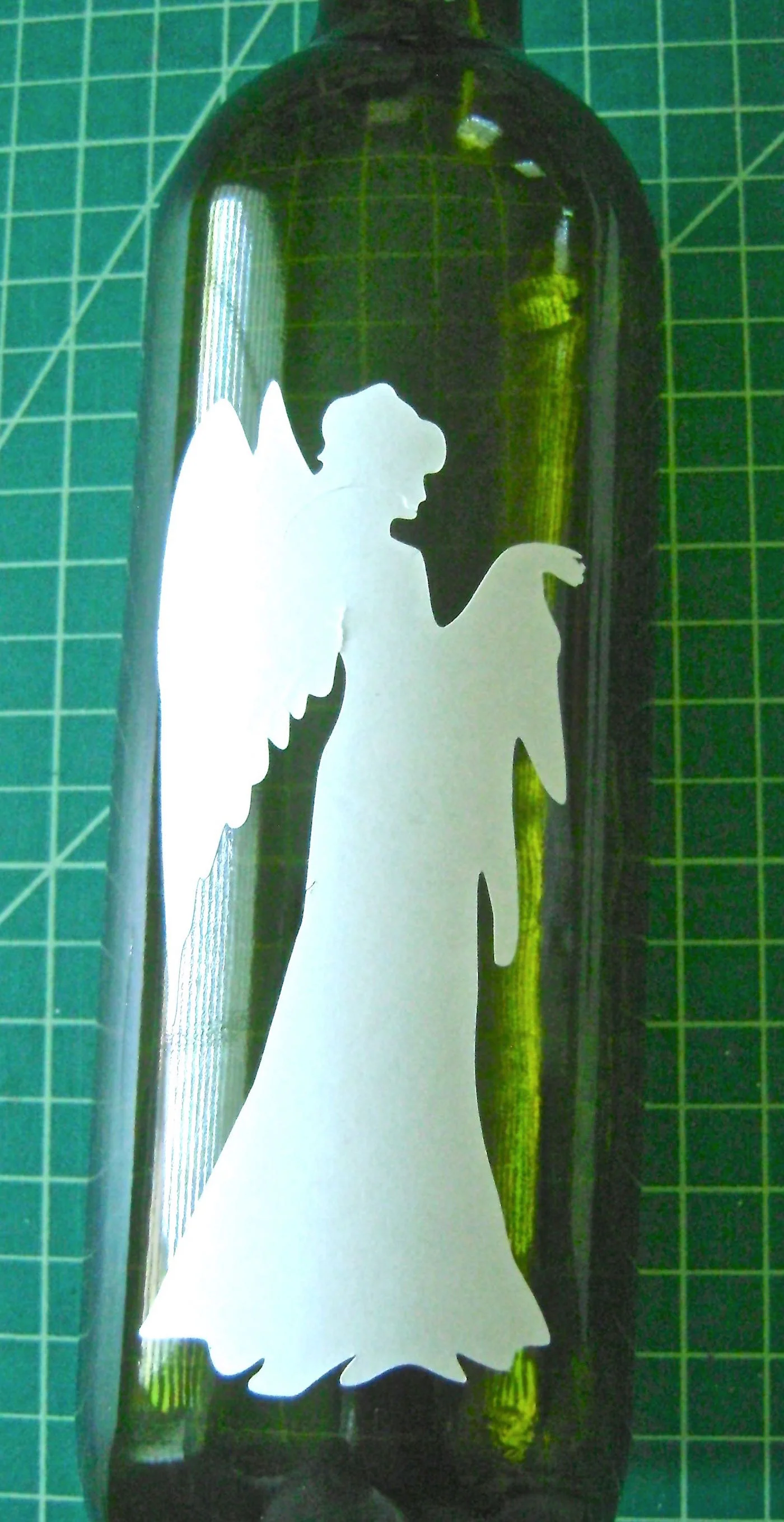 step 3 - Stick the image to the center of the bottle.