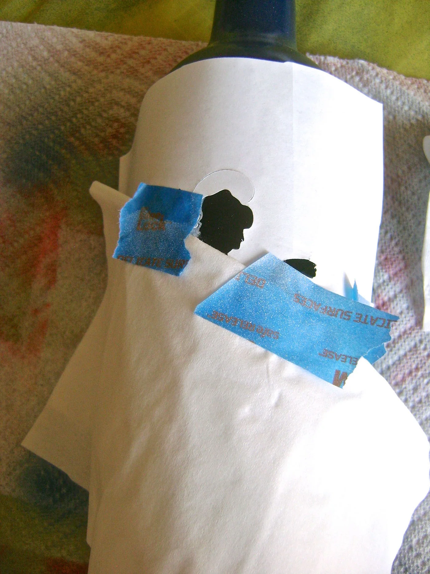 step 9 - Peel off the head and hand pieces. Cover everything but the head and hand and airbrush them with white paint.
