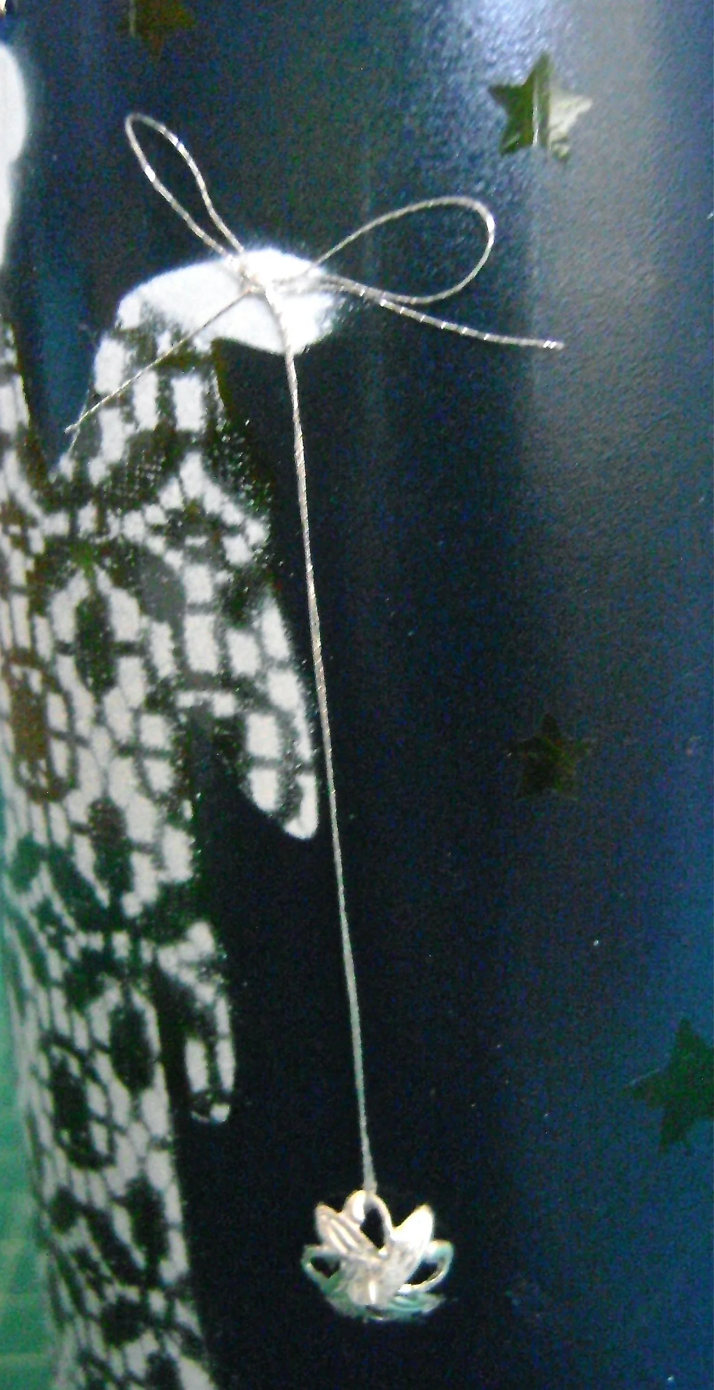 step 13 - Touch the bead cap into the glue and stick it against the bottle.