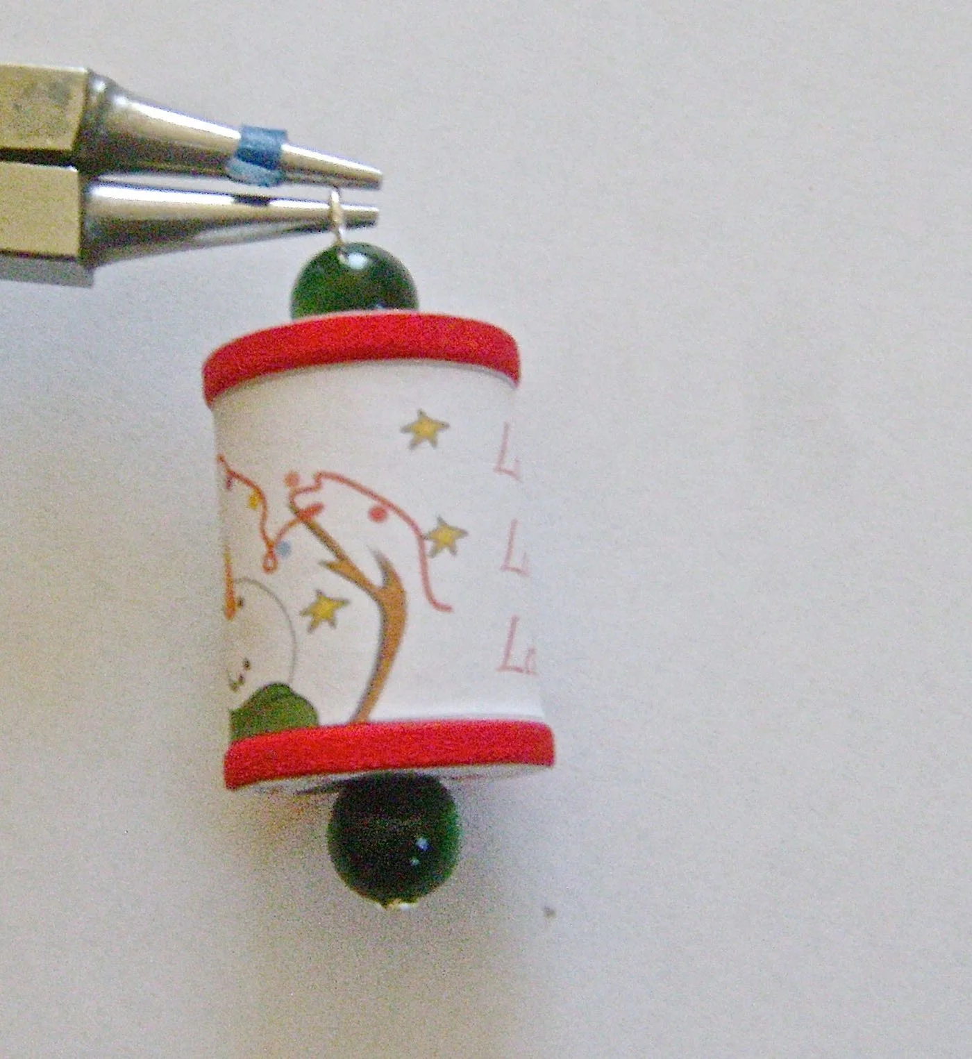 step 9 - Use round nose pliers to create a loop in the wire for hanging.