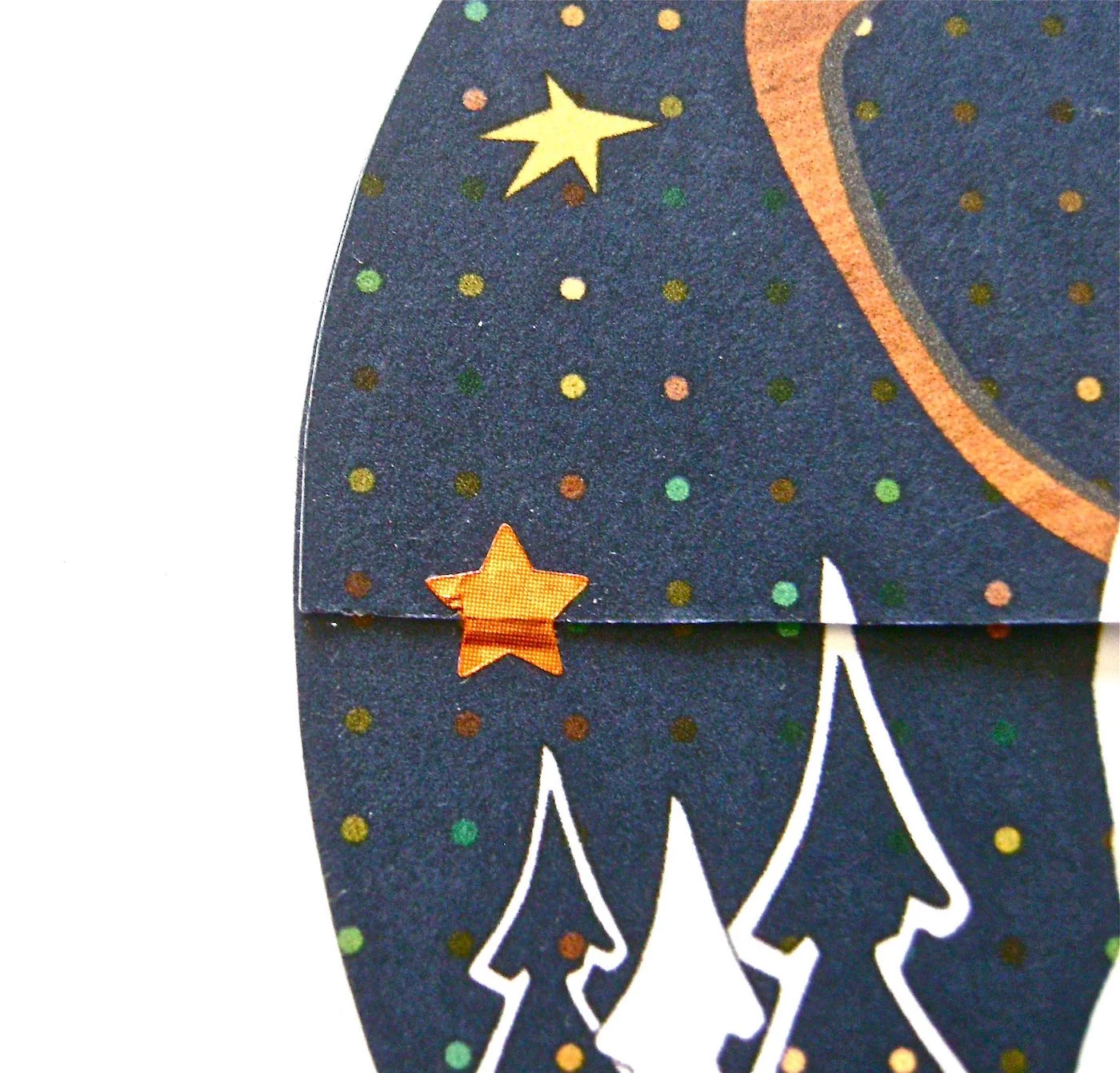 step 11- Insert a gift card in the holder. Close the flap and secure it with a star sticker on the right and left flap edges.