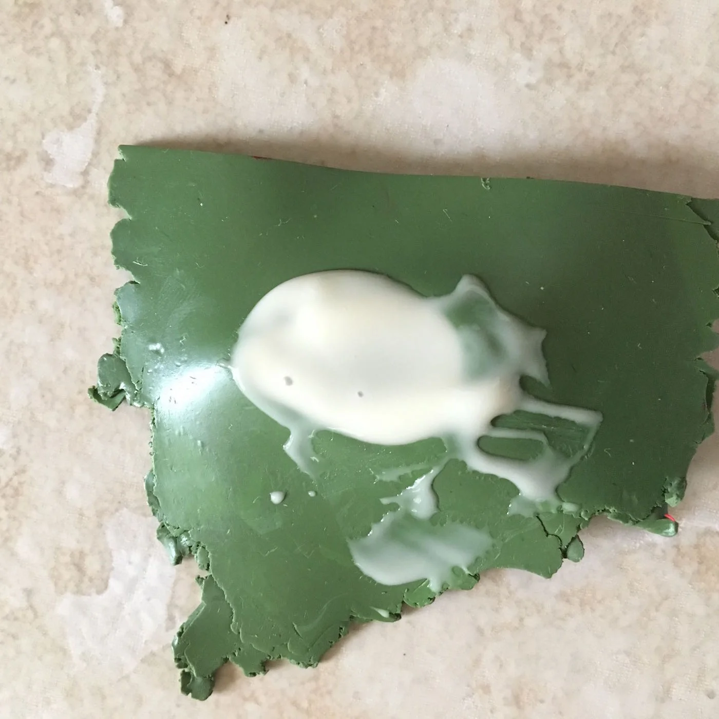 step 5 - As the Etch All directions suggest, apply a heavy coat of cream with the spatula provided and wait 15 minutes. Do not allow the crème to pour over the edge of the clay border. See complete directions for crème application on the container.