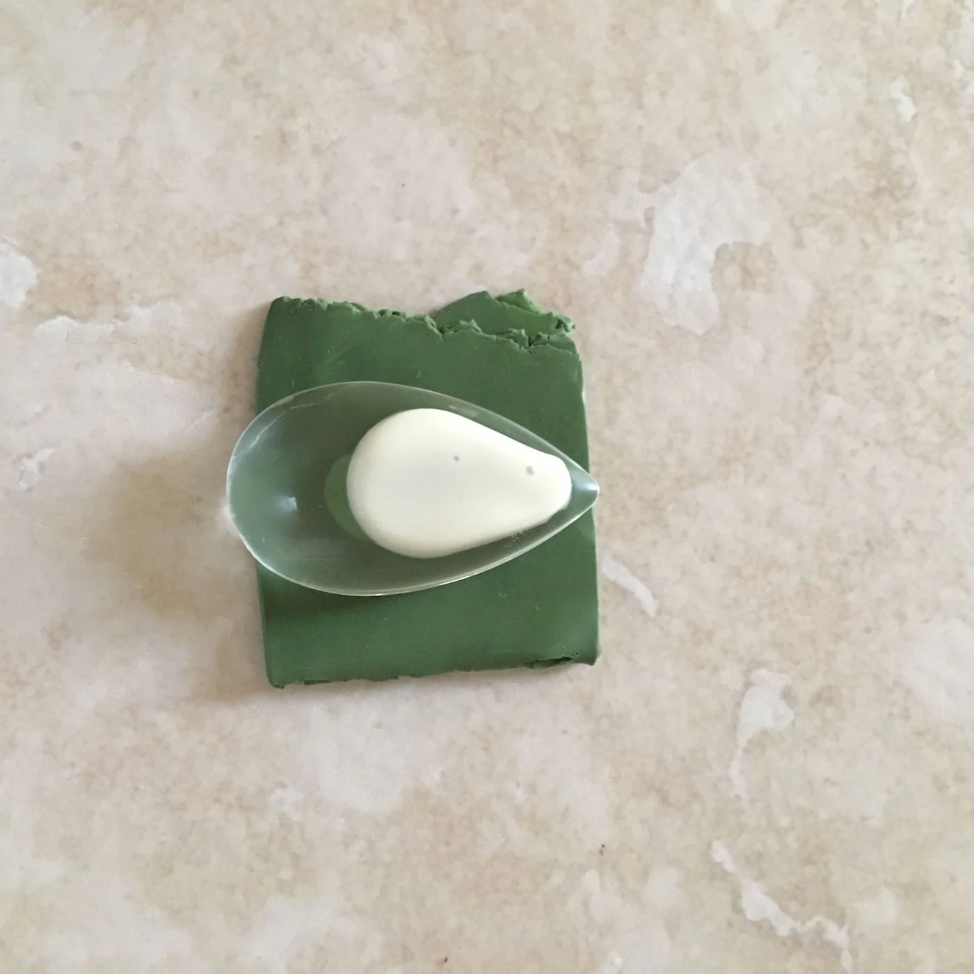 step 6 - Remove the clay first, then the creme. Rinse the crystal under warm water. step 7 - Dry the crystal completely. Dispose of the clay.