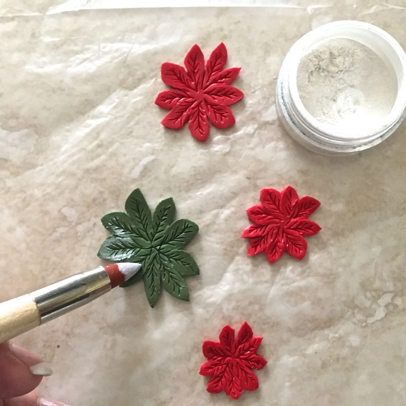 step 5 - Add white mica powder to the clay using your finger or a daubing tool.