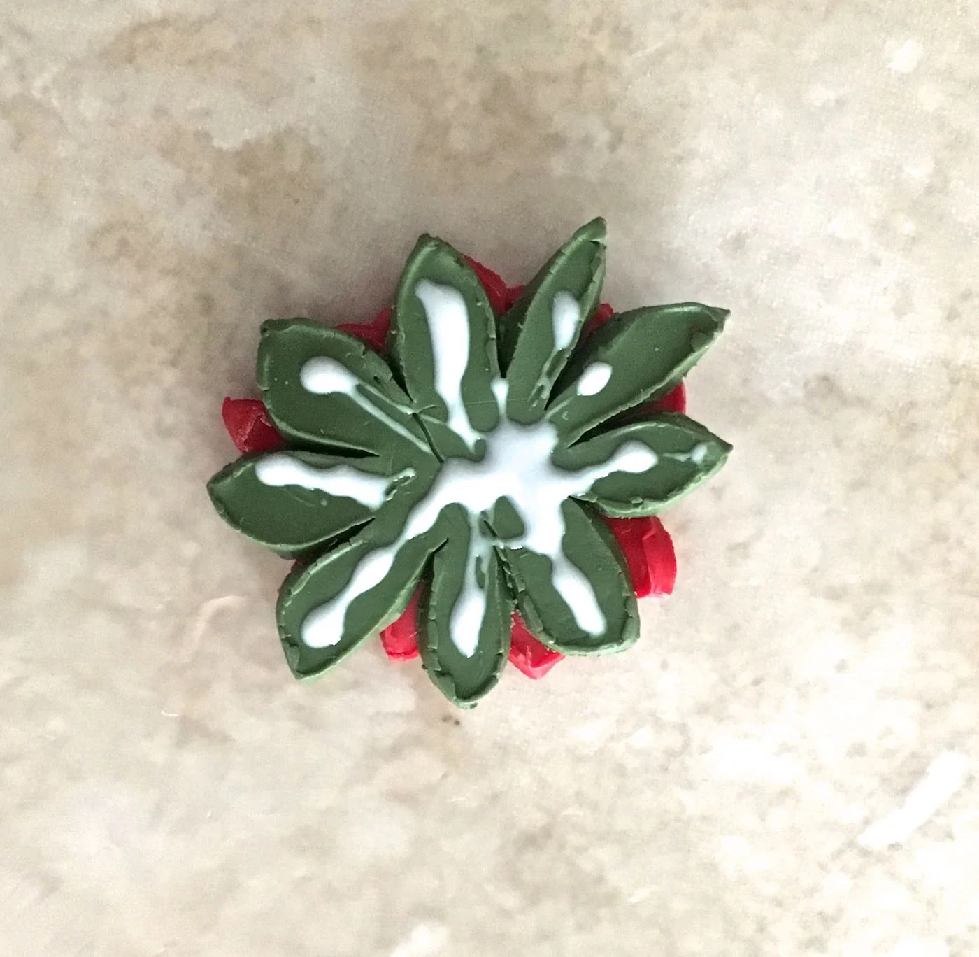 step 10 - Apply Liquid Polymer to the backside of each poinsettia. Add the polymer only on clay that will be touching the glass.