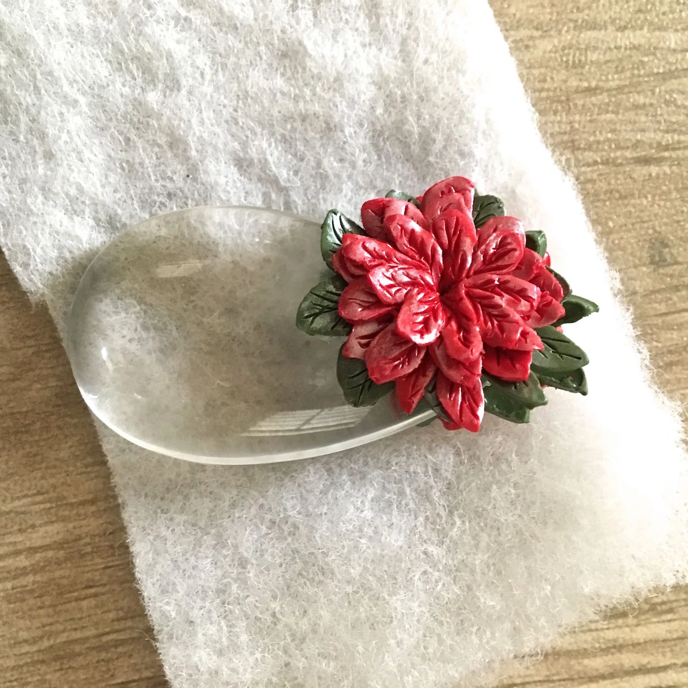12. Place the ornament on a soft cushioned surface like fiberfill. It will “nest” the ornament and not leave a shiny finish on the clay. Bake the piece at 275 degrees for 30 minutes.