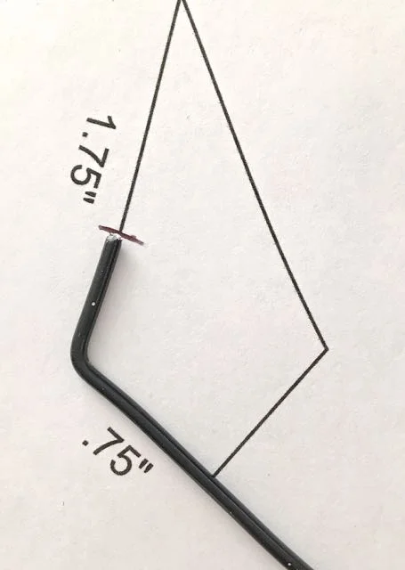 step 13 - Create The Earring Frame Cut two pieces of the 12 gauge wire to measure five inches. Starting at the opening in the fame outline, form the frame shape by following the template shape.