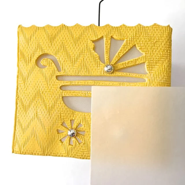 step 22 - Cut parchment paper the size of the four cube walls. Glue the paper inside, against each panel.