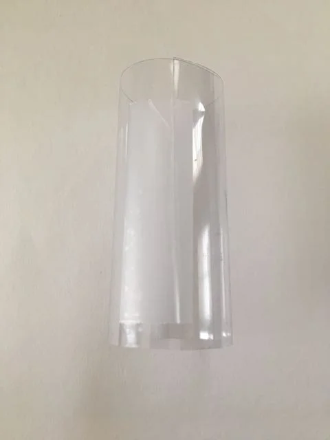step 8 - Cut a piece of clear binder cover material to measure 3” x 4.50”. Roll it into a tube that will fit around the light unit - 1 3/16".