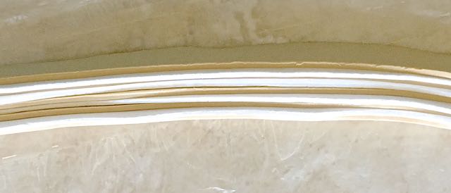 step 3 - Slice the sheets into four equal width strips and stack them, alternating colors.