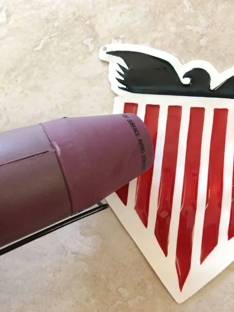 step 10 - Use a heat gun to create a glassy finish on the red and blue clay. The gun needs to be about one inch from the surface to produce the desired effect.