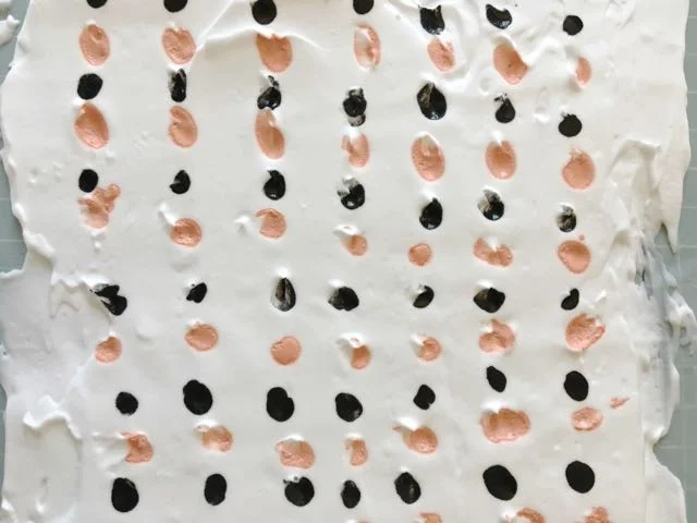 step 5 - Put down as many colors as you like. I chose salmon and black for my fabric. I created the salmon by mixing yellow ink into the red, then softening it with white.