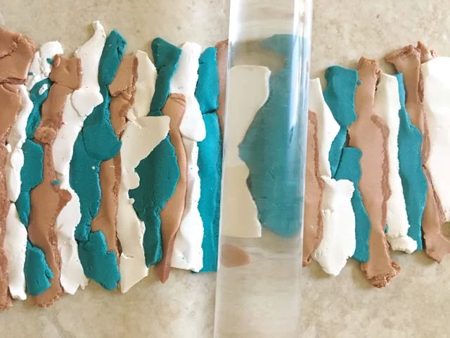 step 3 - Blend the colors by tearing each into thin strips and overlapping slightly. Use an acrylic roller to press them to each other.