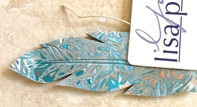 step 14 - Use a plastic credit card to press down on the wire, creating an impression in the clay.