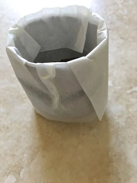 step 23 - Fold the excess paper into the roll to hold everything in place.