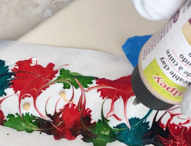 step 5 - Squeeze dots of Gold LPC onto the design straight from the container. Pull your brush through the gold color using smaller strokes.