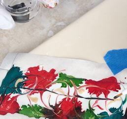 step 6 - Add Black LPC to a small container. Dip your brush and pull a fine black line across the center of the design.