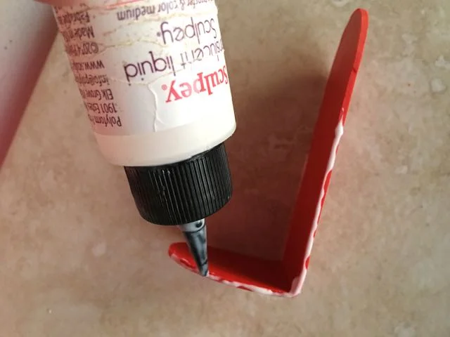Step 8 - Apply translucent liquid polymer to the sides and the angled flap of the box bottom.