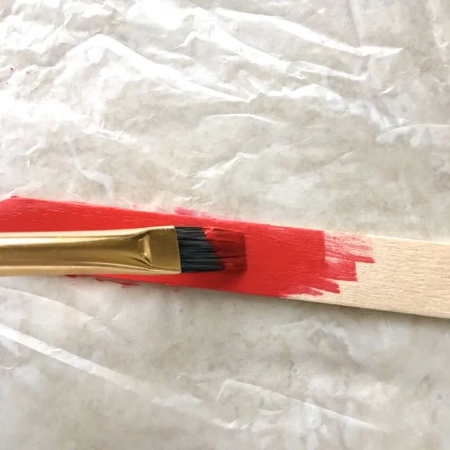 step 2 - Paint the connectors and three craft sticks with red paint on all sides.