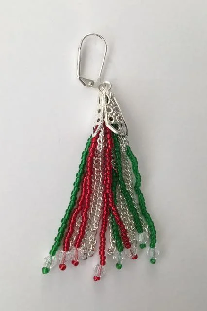 step 6 - Insert the wire into the center of the bead cap. Pull it up so the top of the chain and beads are up inside the cap as far as it will go. Create a loop in the wire. Connect it to a earring wire.