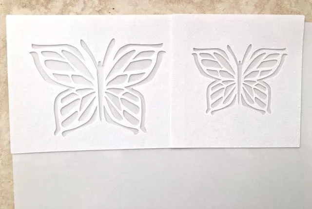 step 3 - Position the stencils on a sheet of Clear Sticker Paper.