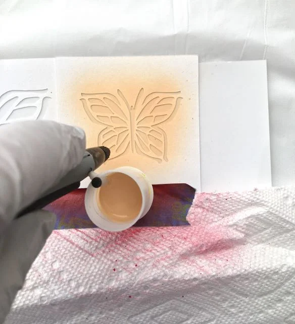 step 5 - Attach a paint cup to the airbrush and spray with your desired paint colors.