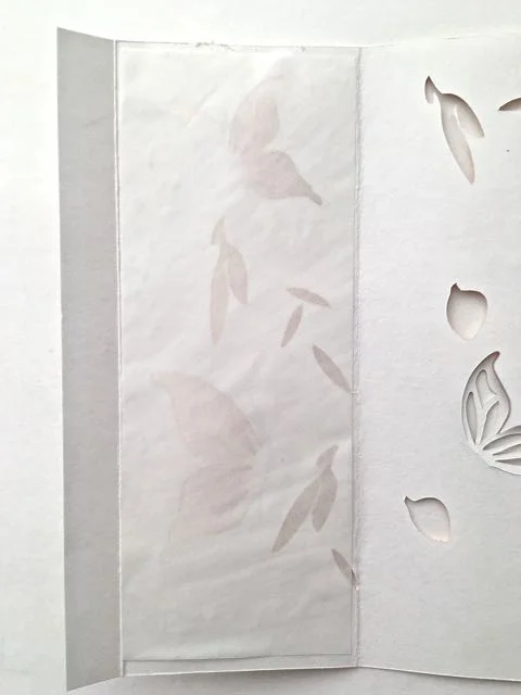 step 9 - Place a parchment sheet on the panel and press to adhere it. Repeat on all panels.
