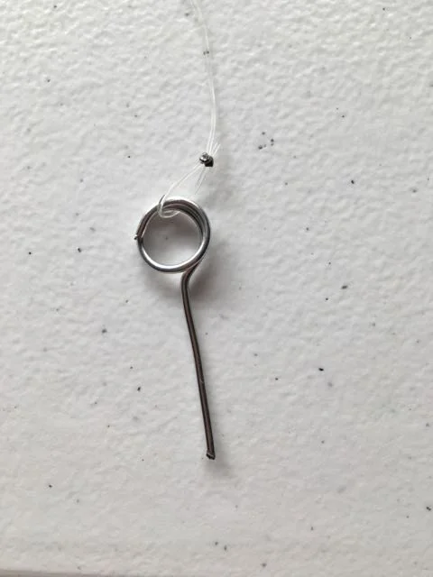 step 5 - Flatten the bead with a crimping tool or pair of pliers. Don’t be too aggressive with the tool or the bead edge may cut through the cord.