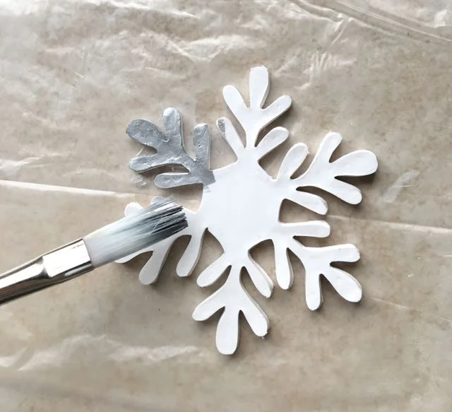 step 16 - Apply silver alcohol ink directly to a small brush and begin painting the surface and sides of the clay.