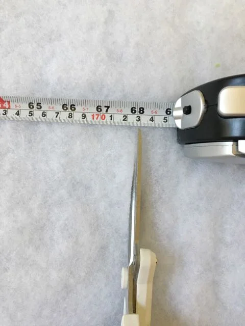 step 6 - The Padding - Cut batting to measure 68” x 56. This will give you four extra inches on all sides when it comes time to wrap the headboard.