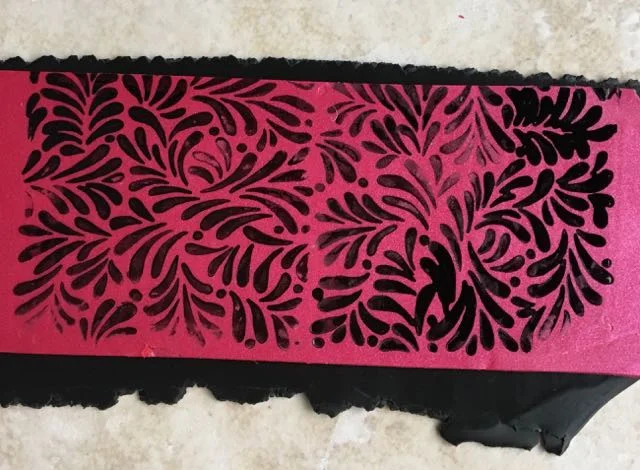 step 4 - Allow the ink to dry then place the painted clay piece on top of the black clay.