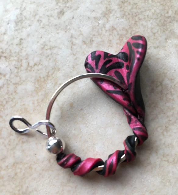 step 13 - Open one end of a figure eight link and attach it to the ring on one side of the ball bead.