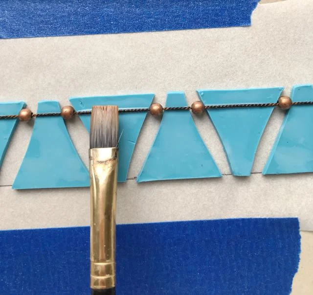 step 16 - Apply Liquid Polymer Clay to the cord’s surface.