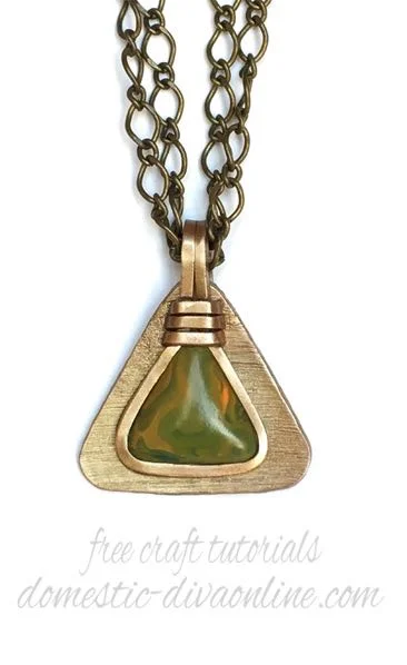 Pendant measures 2” x 2.75” with bail