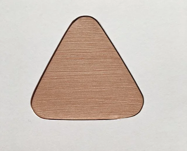 step 3 - Place the cardstock on the clay and use the opening as a guide for cutting out the clay with a craft knife. Set the clay aside. This will be the backing piece.